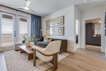 Wood-style flooring in living, dining, and bath areas